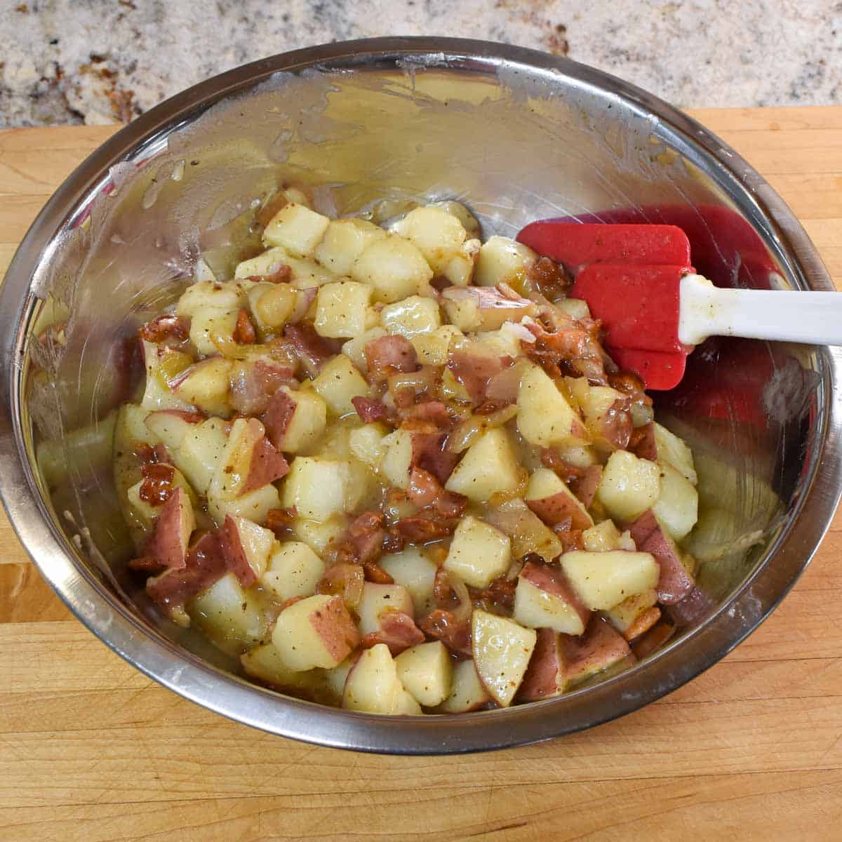 Finished German potato salad in a bowl.